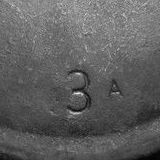 Skillet size number with pattern letter.