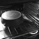 A skillet being oven seasoned.
